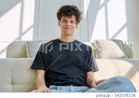 Young guy university student talking looking in web camera, at home Young guy university student talking looking in web camera, at home 142576116