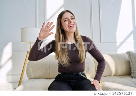 Web cam view of young woman talking looking in camera, online meeting, video call Web cam view of young woman talking looking in camera, online meeting, video call 142576127