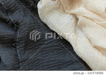 Textures created with fabric layers in contrasting colors for display or design purposes 142578986