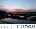 Venetian Lagoon sunset with pink clouds and water reflection Venetian Lagoon sunset with pink clouds and water reflection 142579586