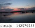 Venetian Lagoon sunset with pink clouds and water reflection Venetian Lagoon sunset with pink clouds and water reflection 142579588