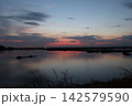 Venetian Lagoon sunset with pink clouds and water reflection Venetian Lagoon sunset with pink clouds and water reflection 142579590