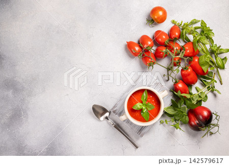 Fresh tomato basil soup in white bowl Fresh tomato basil soup in white bowl 142579617
