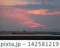 Venetian Lagoon sunset with pink clouds and water reflection Venetian Lagoon sunset with pink clouds and water reflection 142581219