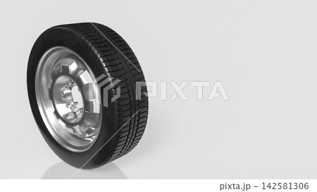 Black Rubber Tire with Shiny Silver Rim on Light Background 3d render. 142581306