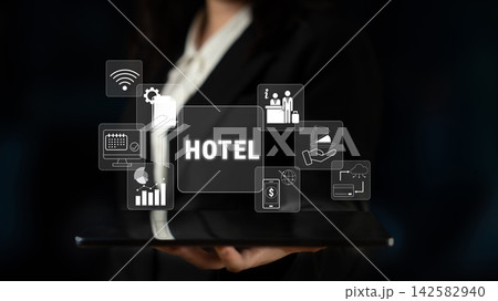 Modern Digital Concept of Hotel Management with Various Icons and Technologies for Hospitality Industry in a Business Setting Quark 142582940
