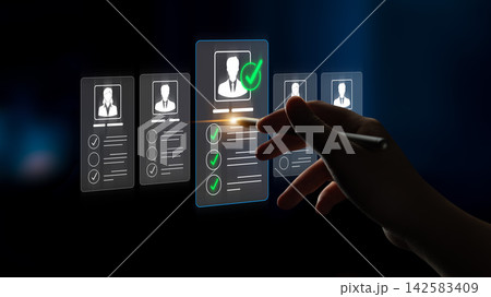 A hand interacts with a virtual interface displaying candidate profiles. This image represents the modern recruitment process emphasizing selection and decision-making in hiring. Sigmoid A hand interacts with a virtual interface displaying candidate profiles. This image represents the modern recruitment process emphasizing selection and decision-making in hiring. Sigmoid 142583409