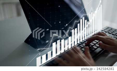 Business professional analyzing financial data on laptop with modern graphics, financial growth charts, and keyboard focus in office environment Copula Business professional analyzing financial data on laptop with modern graphics, financial growth charts, and keyboard focus in office environment Copula 142584281