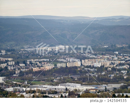 City expansion visuals. City spreading across hills featuring residential clusters and transit pathways City expansion visuals. City spreading across hills featuring residential clusters and transit pathways 142584535
