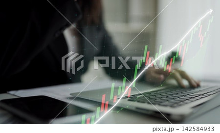 Business Professional Analyzing Stock Market Data with Laptop Graphs and Charts, Focused on Financial Growth and Market Trends in Modern Office Space Copula 142584933