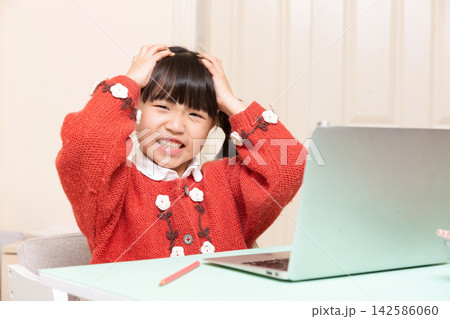 Frustrated Asian schoolgirl using laptop, angry child shouting at computer, online learning stress concept Frustrated Asian schoolgirl using laptop, angry child shouting at computer, online learning stress concept 142586060