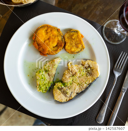 Fried swordfish fillet served with eggplant Fried swordfish fillet served with eggplant 142587607