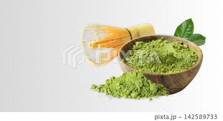 Matcha. Matcha powder is beautifully arranged in a wooden bowl alongside a bamboo whisk Matcha. Matcha powder is beautifully arranged in a wooden bowl alongside a bamboo whisk 142589733