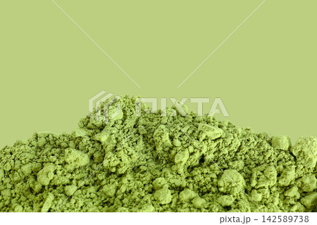 Matcha. Matcha green tea powder is finely textured and vibrant, showcasing its rich color 142589738