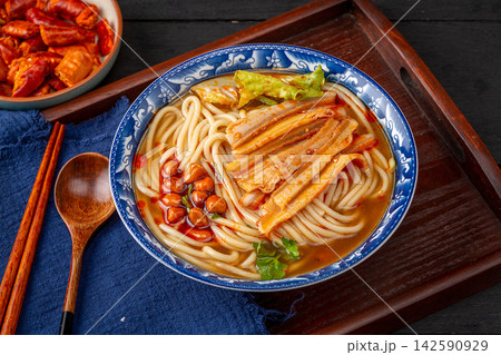 chinese Hot and Spicy Rice Noodle Soup with Shredded Beef Tripe, Traditional Hunan Mifen Bowl 142590929