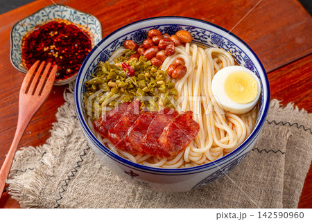 spicy Chinese Rice Noodle Soup with Sliced Sweet Chinese Sausage, Traditional Mifen Noodle Bowl spicy Chinese Rice Noodle Soup with Sliced Sweet Chinese Sausage, Traditional Mifen Noodle Bowl 142590960