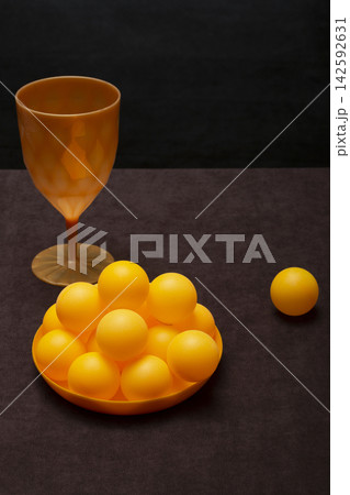 Orange balls in a plate on the table Orange balls in a plate on the table 142592631