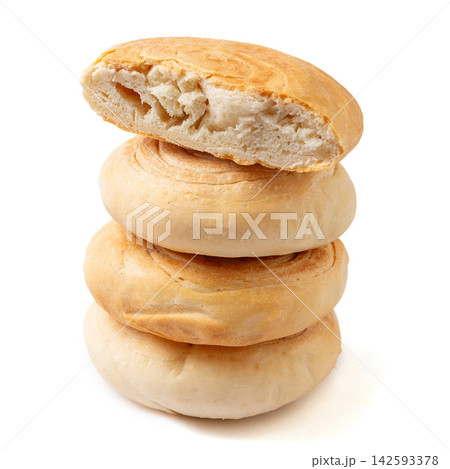 A stack of traditional Chinese Shaanxi style baked baijimo flatbread buns, isolated A stack of traditional Chinese Shaanxi style baked baijimo flatbread buns, isolated 142593378