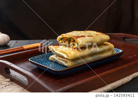 pan-fried Chinese chive and egg pockets, Sanxian vegetable turnover pancake served with chili dipping sauce. pan-fried Chinese chive and egg pockets, Sanxian vegetable turnover pancake served with chili dipping sauce. 142593411