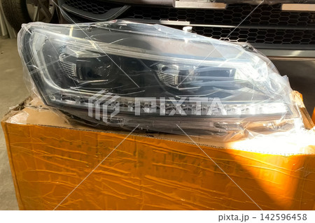 New car headlights, replacement of headlights on car. New car headlights, replacement of headlights on car. 142596458