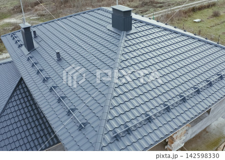 Corrugated metal roof and metal roofing. Modern roof made of metal. Corrugated metal roof and metal roofing. Modern roof made of metal. 142598330