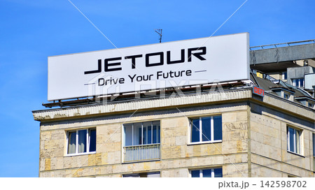 Warsaw, Poland. 15 August 2026. Urban landscape. Neon sign with the inscription: Jetour. Drive Your Future. Warsaw, Poland. 15 August 2026. Urban landscape. Neon sign with the inscription: Jetour. Drive Your Future. 142598702