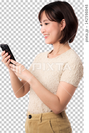 Asian woman using smartphone with joyful smile while standing in profile isolated on transparent background 142598848