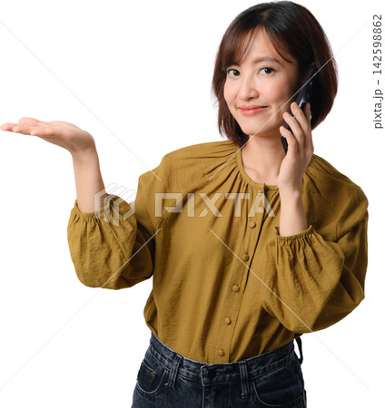 Asian woman in mustard blouse presents empty space with friendly smile and thoughtful gesture against transparent background Asian woman in mustard blouse presents empty space with friendly smile and thoughtful gesture against transparent background 142598862