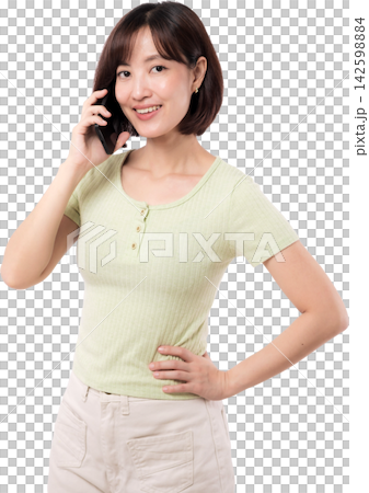 Asian woman smiling while talking on mobile phone with confident friendly expression Asian woman smiling while talking on mobile phone with confident friendly expression 142598884