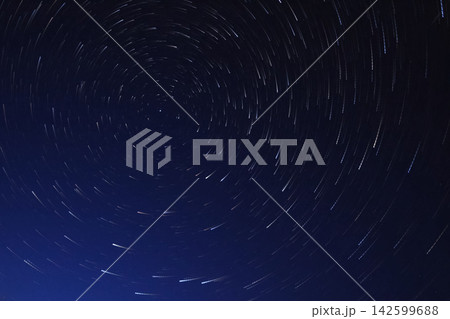 Long exposure starry sky, twisted tracks of stars. Long exposure starry sky, twisted tracks of stars. 142599688
