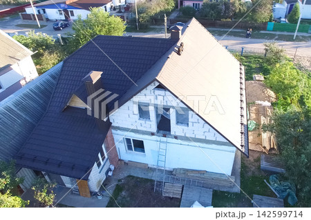 Corrugated metal roof and metal roofing. Modern roof made of metal. Corrugated metal roof and metal roofing. Modern roof made of metal. 142599714