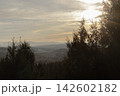 Forest landscape with mountains under a bright hazy sunset 142602182