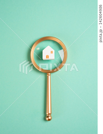 House and magnifying glass. Searching for housing. Renting or buying a home. Real estate research, property investment, mortgage decisions, housing market analysis, and relocation planning. House and magnifying glass. Searching for housing. Renting or buying a home. Real estate research, property investment, mortgage decisions, housing market analysis, and relocation planning. 142604986