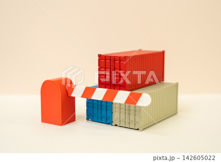 Shipping containers and closed barrier gate, customs control and trade barriers concept, tariff wars. Import restrictions, border inspections and disrupted supply chains. International trade conflicts Shipping containers and closed barrier gate, customs control and trade barriers concept, tariff wars. Import restrictions, border inspections and disrupted supply chains. International trade conflicts 142605022