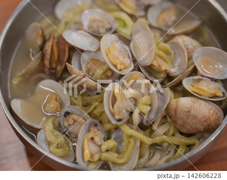 Delicious Clear Korean Seafood Noodle Soup with Fresh Clams Delicious Clear Korean Seafood Noodle Soup with Fresh Clams 142606228