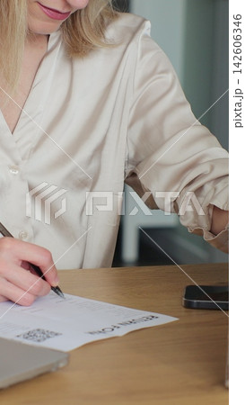 Vertical video. A person fills out a return order at home. 142606346