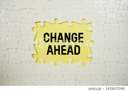 Jigsaw puzzle with a missing piece with "Change Ahead" on yellow background Jigsaw puzzle with a missing piece with "Change Ahead" on yellow background 142607090