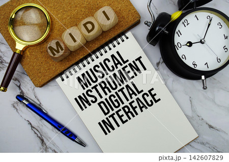 MIDI Musical Instrument Digital Interface text written on notepad with calculator and magnifying glass on marble background 142607829