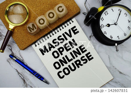 MOOC Massive Open Online Course text written on notepad with calculator and magnifying glass on marble background MOOC Massive Open Online Course text written on notepad with calculator and magnifying glass on marble background 142607831
