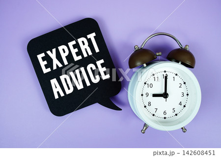 Expert Advice text on speech bubble with alarm clock on purple background Expert Advice text on speech bubble with alarm clock on purple background 142608451