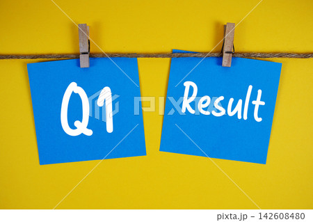 Q1 Result paper notes hanging on the rope with clothespins 142608480