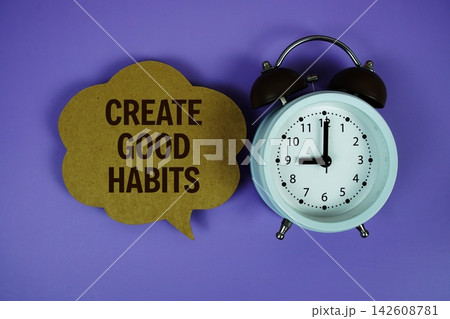 Create Good Habits text on speech bubble with alarm clock on purple background Create Good Habits text on speech bubble with alarm clock on purple background 142608781