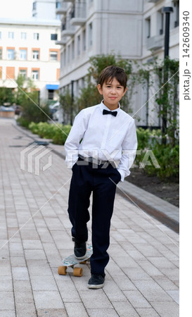 Modern Schoolboy with Skateboard on September 1, Back to School, First Day of Classes, Student Lifestyle, Childhood Hobbies and School Fashion 142609340
