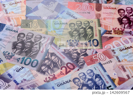 Ghana, Ghanaian paper money, cedi banknotes as currency for exchange or travel. Ghana money Ghana, Ghanaian paper money, cedi banknotes as currency for exchange or travel. Ghana money 142609567