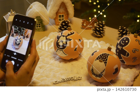 Photographing Christmas baubles for decorating a tree or a room 142610730