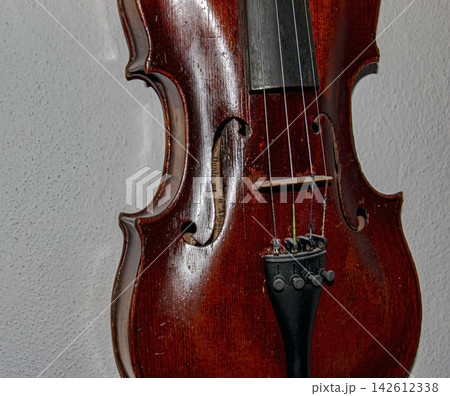 Vintage Violin Body with F Holes Bridge and Strings Close Up 142612338