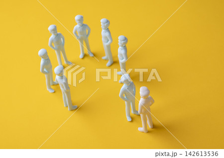 Social exclusion and outsider concept with one person blocked from joining a group Social exclusion and outsider concept with one person blocked from joining a group 142613536