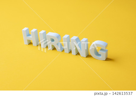 Hiring, recruitment and talent acquisition concept with large white HIRING letters Hiring, recruitment and talent acquisition concept with large white HIRING letters 142613537