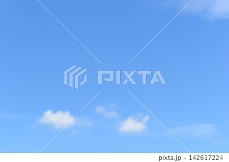 beautiful blue sky and white fluffy group of clouds with sunrise in the morning, natural background 142617224