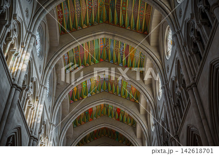 Intricate geometric painted ceiling panels along the ribbed vaults of Almudena Cathedral Intricate geometric painted ceiling panels along the ribbed vaults of Almudena Cathedral 142618701